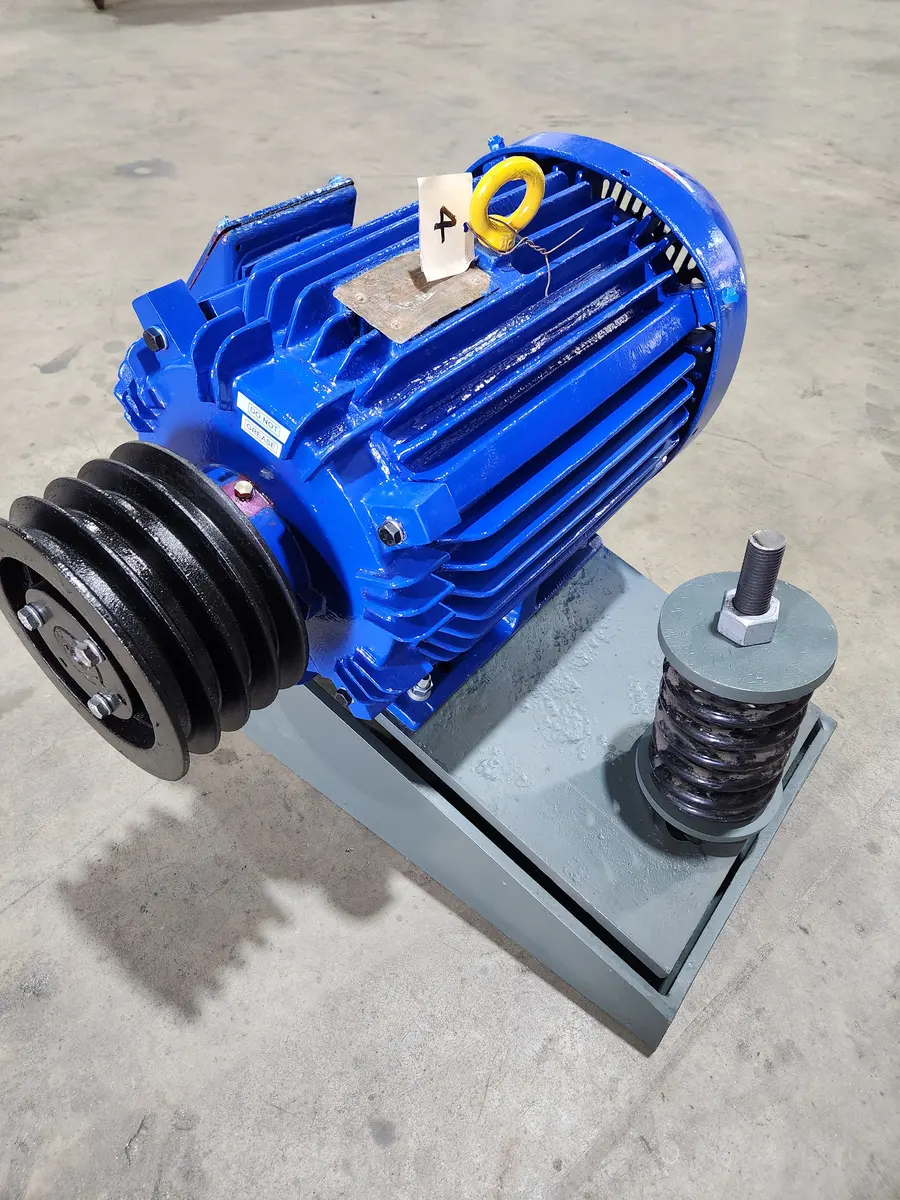 Repaired and repainted blue electric motor with a multi-groove sheave on an adjustable spring base