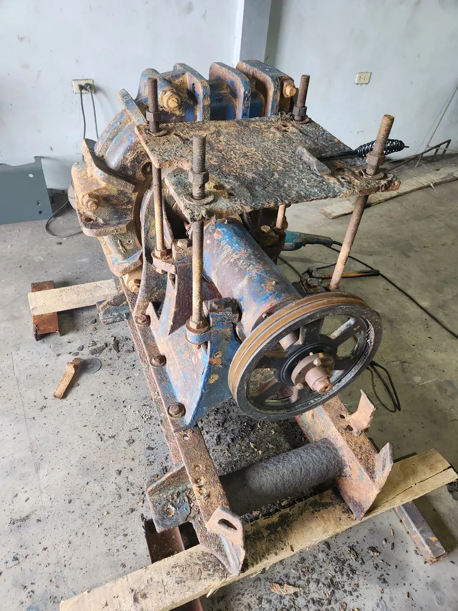 Heavily corroded slurry pump and drive frame before refurbishment