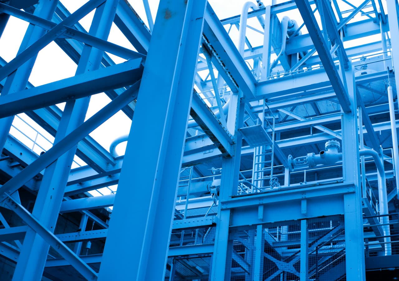 Blue painted structural steel framework of an industrial plant